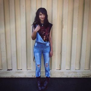 Distressed denim overalls